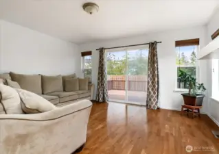 Step from the cozy family room right onto the backyard deck