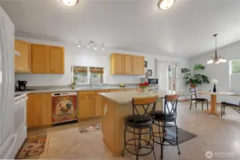 Kitchen view with the island. ALL counters are solid granite