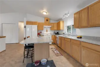 Galley style kitchen with large island.