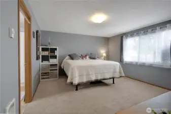 Primary bedroom nice size with walk in closet and bath with shower.