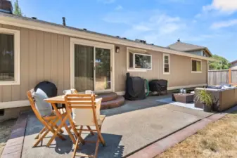 Backyard patio perfect for grilling or relaxing.