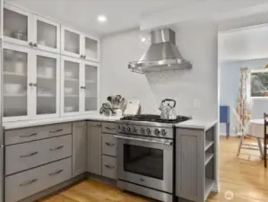 The kitchen is truly the heart of the home—fully remodeled with premium appliances, sleek cabinetry, and creative storage solutions that make daily living effortless.