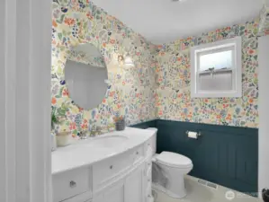 The fully remodeled bathroom showcases modern finishes and a clean, classic feel.
