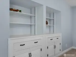Massive custom built-in wall unit adds tons of storage and personality.