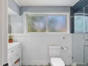 The updated ¾ bath features tasteful finishes and a spa-like feel—this space is all about rest, relaxation, and refined comfort.