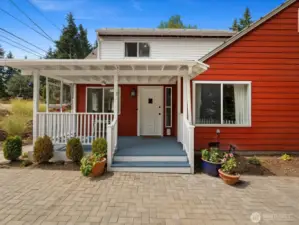 A welcoming covered front porch sets the tone the moment you arrive—offering classic curb appeal and a cozy spot to sip your favorite drink, wave to neighbors, or simply enjoy the quiet charm of this sweet Shoreline street. It’s the kind of entry that makes you feel at home before you even step inside.