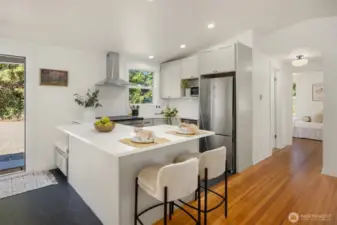 Fresh updates include new flooring in the entry and Kitchen, den/office, and bathroom.  The original 1942 Fir Floors were refinished giving them a fresh lease on time.  All new paint and hardware throughout as well.