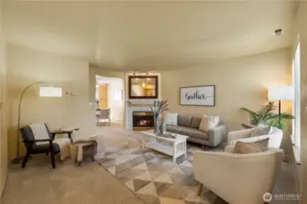 This living room is spacious and inviting. Note the gas fireplace for cozy evenings at home.