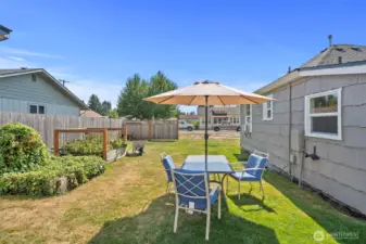 A lovely area to hang out with raised gardening beds.