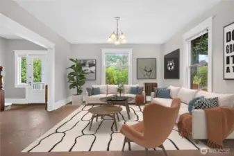 Comfortable shared space connects easily with the dining area. (Virtually Staged.)