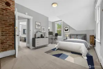 Largest upstairs bedroom with abundant natural light and walk-in closet. (Virtually Staged.)
