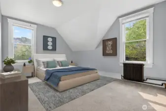 Second-largest upstairs bedroom with ample natural light and versatile layout. (Virtually Staged.)