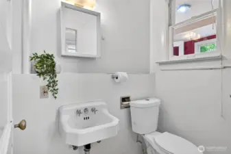 Main floor powder room conveniently located off the kitchen.