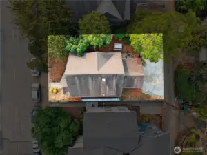 Aerial view above the property showing the roofline and approximate lot boundaries.