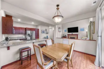 1/2 wall provides separation from main living to dining space