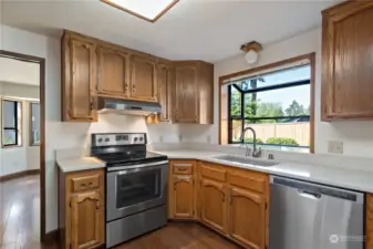 Solid wood cabinet doors with plenty of cabinet and counter space- perfect for entertaining. Kitchen includes a garden window and instant hot-water dispenser.