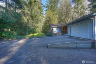 View of front yard, driveway parking and courtyard.