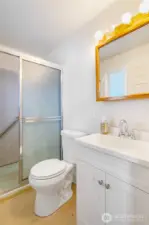 Primary bathroom has a sturdy grab bar in the shower for ease of moving in and out.