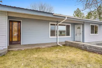 Two front doors to access the home. Enter into the white door to go into the family room.