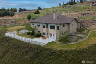 Rear of the home and backyard
