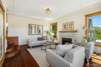 Great SW light in the living room and entry with great ceiling height and wood framed windows.