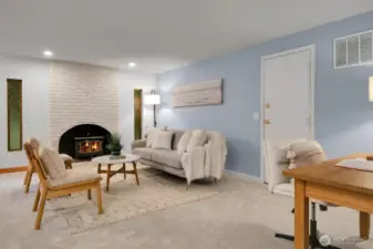 Spacious family room offers ample living space, with convenient direct access to the garage.