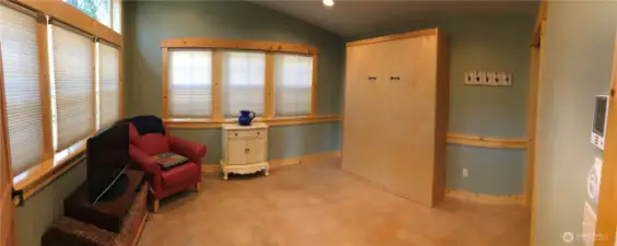 Main room in guest house/studio with Murphy bed.