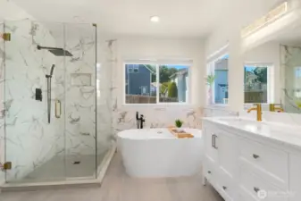 Primary bathroom with tiled shower and soaking tub