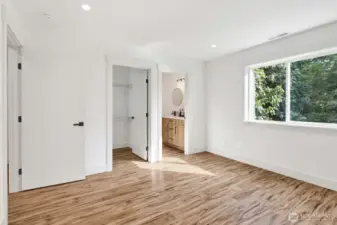 Owner's suite features a well appointed bath with dual sink and Walk in Closet