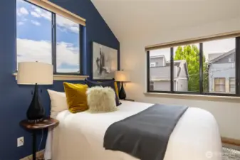 Primary bedroom with vaulted ceilings