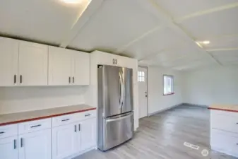 View from kitchen looking towards the front door. New Refrigerator!