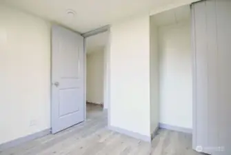 View from bedroom looking towards the hallway. View of closet.