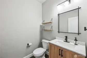 First floor powder room, conveniently located next to the main living room.