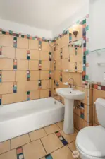 Well-appointed apartment bath with clean finishes and functional design