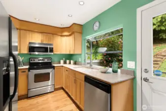 Big greenhouse window looks out on back patio