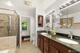 Deluxe bathroom between Primary and Second bedrooms has double sinks, separate shower and soaking tub