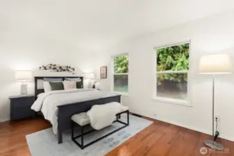 Second bedroom is almost as big as the Primary and has a lovely view out to the back patio and surrounding greenery