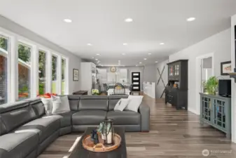 The perfectly sized great room opens to the deck overlooking the yard and lake.
