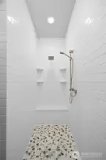 Primary en suite walk in shower.