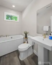 Main floor bathroom next to bedroom one and main floor living.
