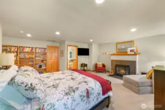 The spacious primary suite encompasses the entire upper floor.