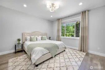 Main floor bedroom suite with walk in closet and private bathroom