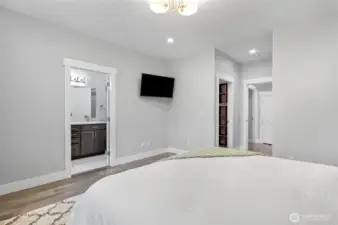 The main floor primary suite has a full bathroom and walk in closet.