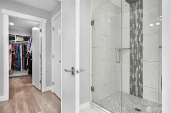 Fully tiled walk in shower in the upstairs primary bedroom.
