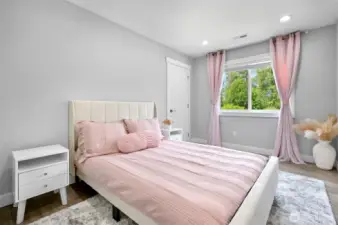 Upstairs bedroom has a walk in closet and looks out to the backyard