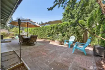 Plenty of patio space for a hot tub or seating area, shown here. Make it your own!