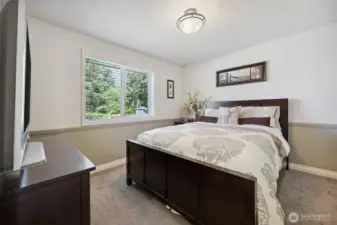 2nd Bedroom. Plenty of room for a queen size bed, nightstand and dresser. Not pictured: Both bedroom closets have custom inserts with drawers. Excellent for storage.