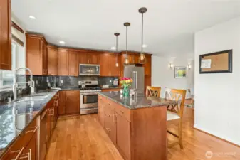 Expansive storage and large island in the kitchen. Solid wood cabinets.