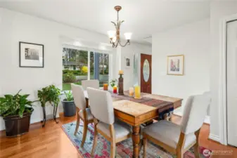 Dining room open to the entry and kitchen