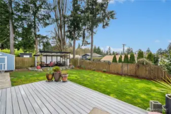 Back deck with back patio and large yard. Sunset views from the backyard